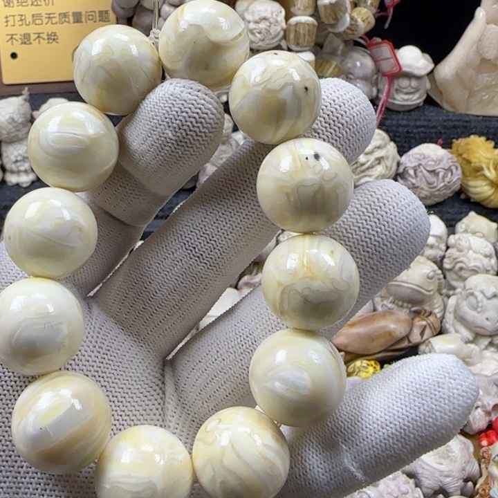瑞***妍非金属手串臼齿雕刻手串