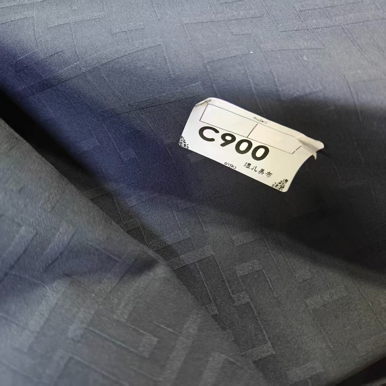 900黑色马尼提花四面弹防水冲锋衣布料