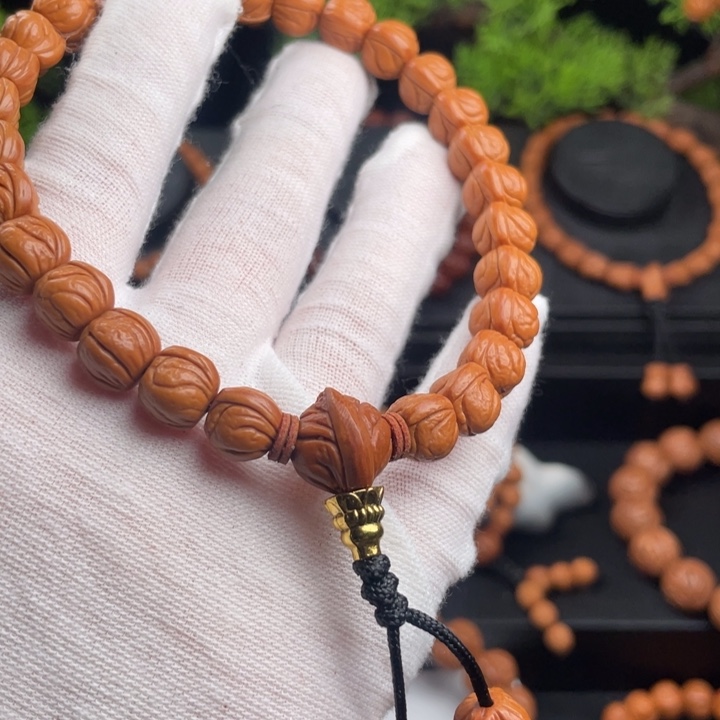 多***扬桃核吊坠精品手持