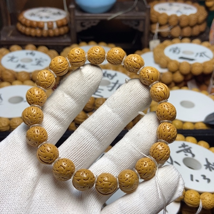 桃核手串刘****、朱雀先手串