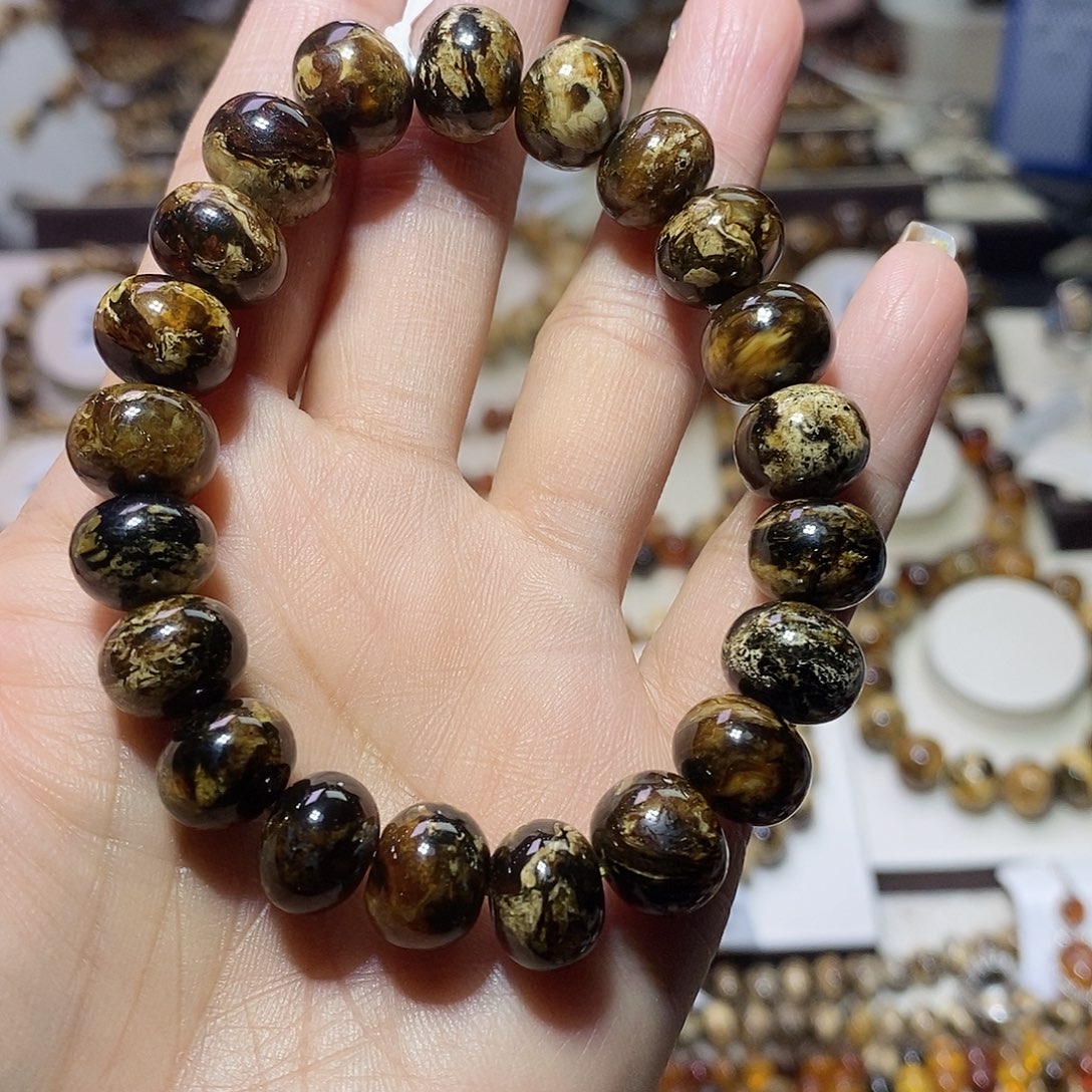 煜***焱琥珀未镶嵌裸石熊猫花11+