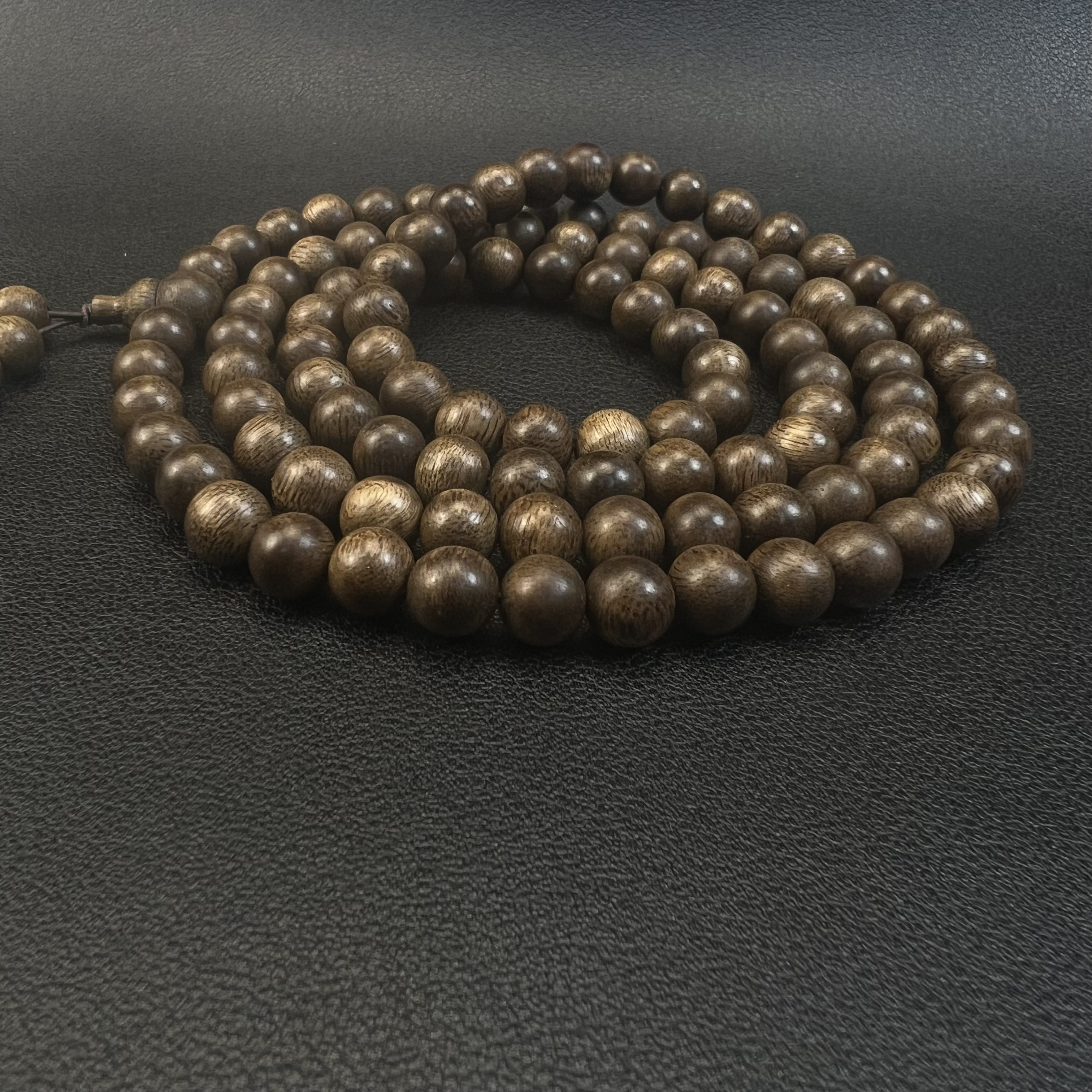 海南莺歌绿棋楠0.8*108颗九分沉手串