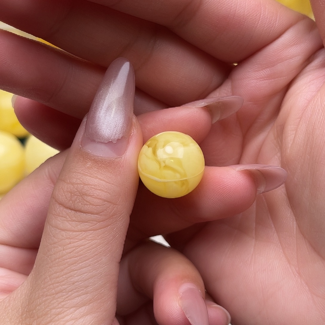 刘***刚琥珀未镶嵌裸石蜜蜡圆珠梦