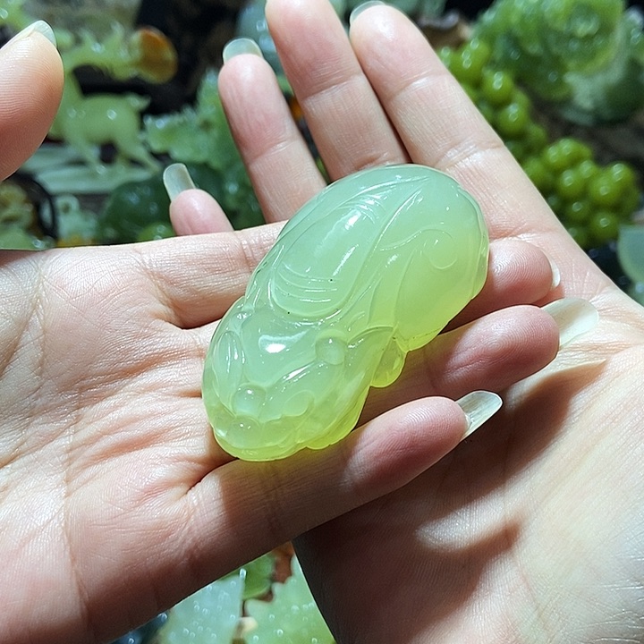 蛇纹石玉手把件合金