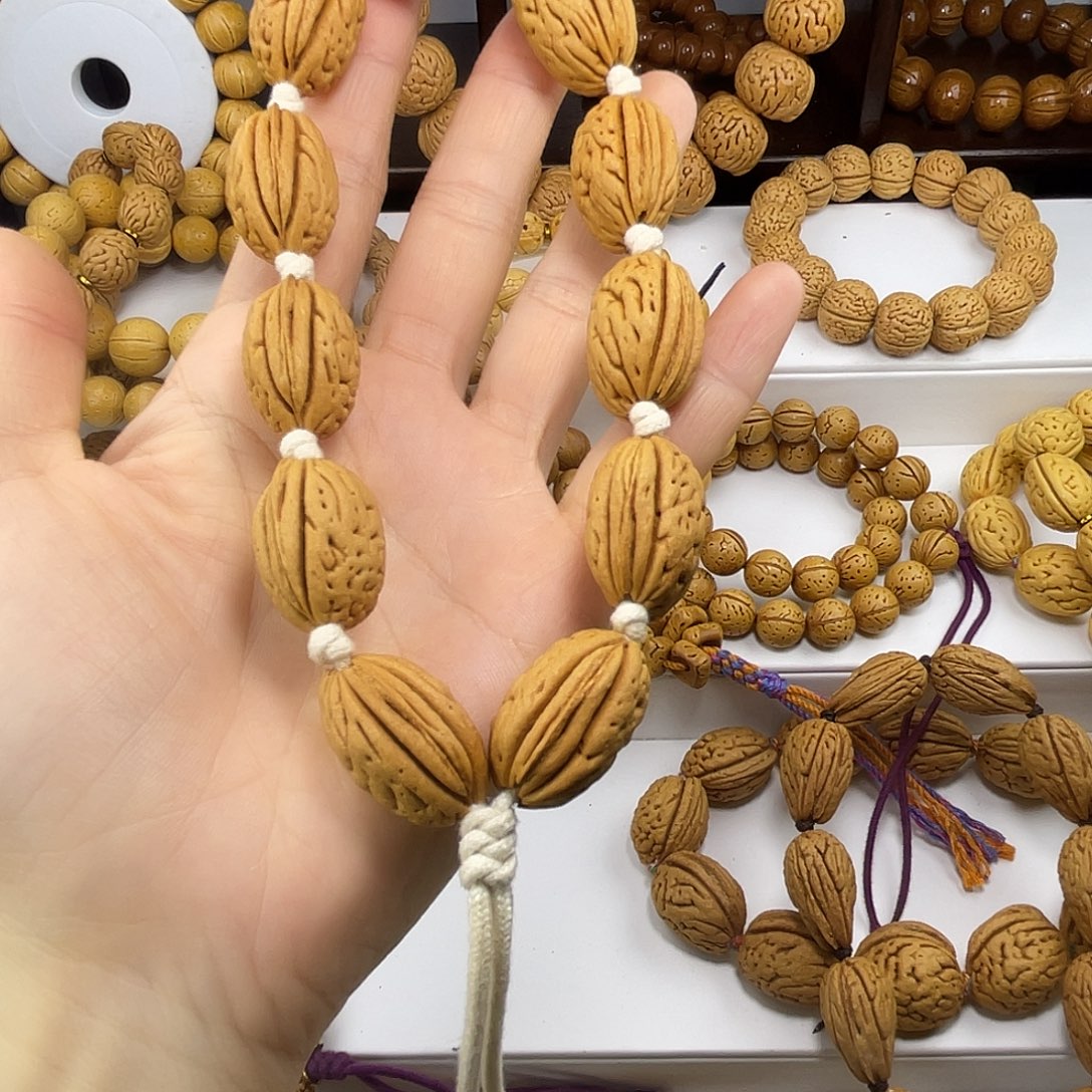 逗***～东北脑纹桃核16钱袋子