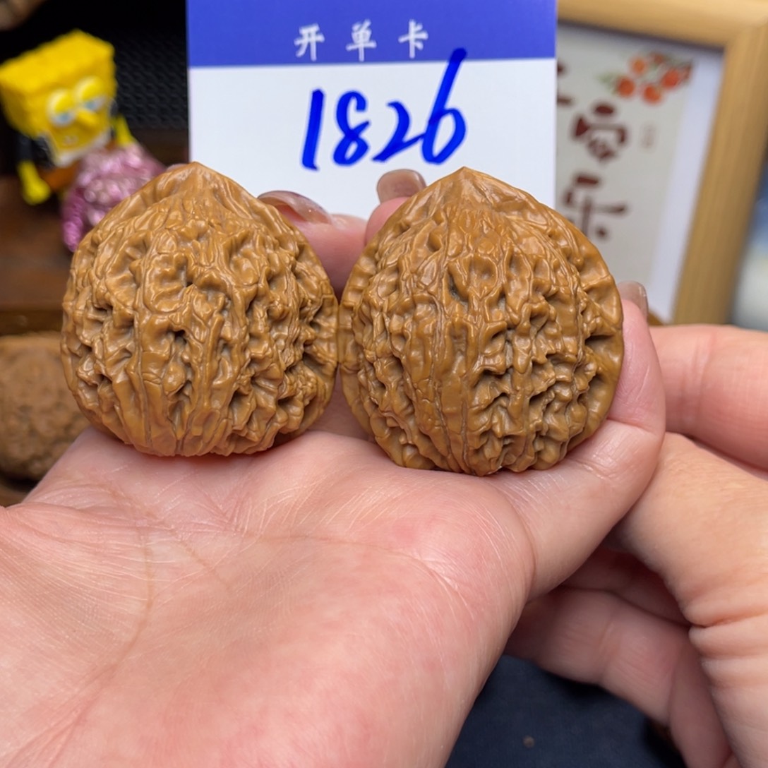 桃核把件水龙纹42李。  