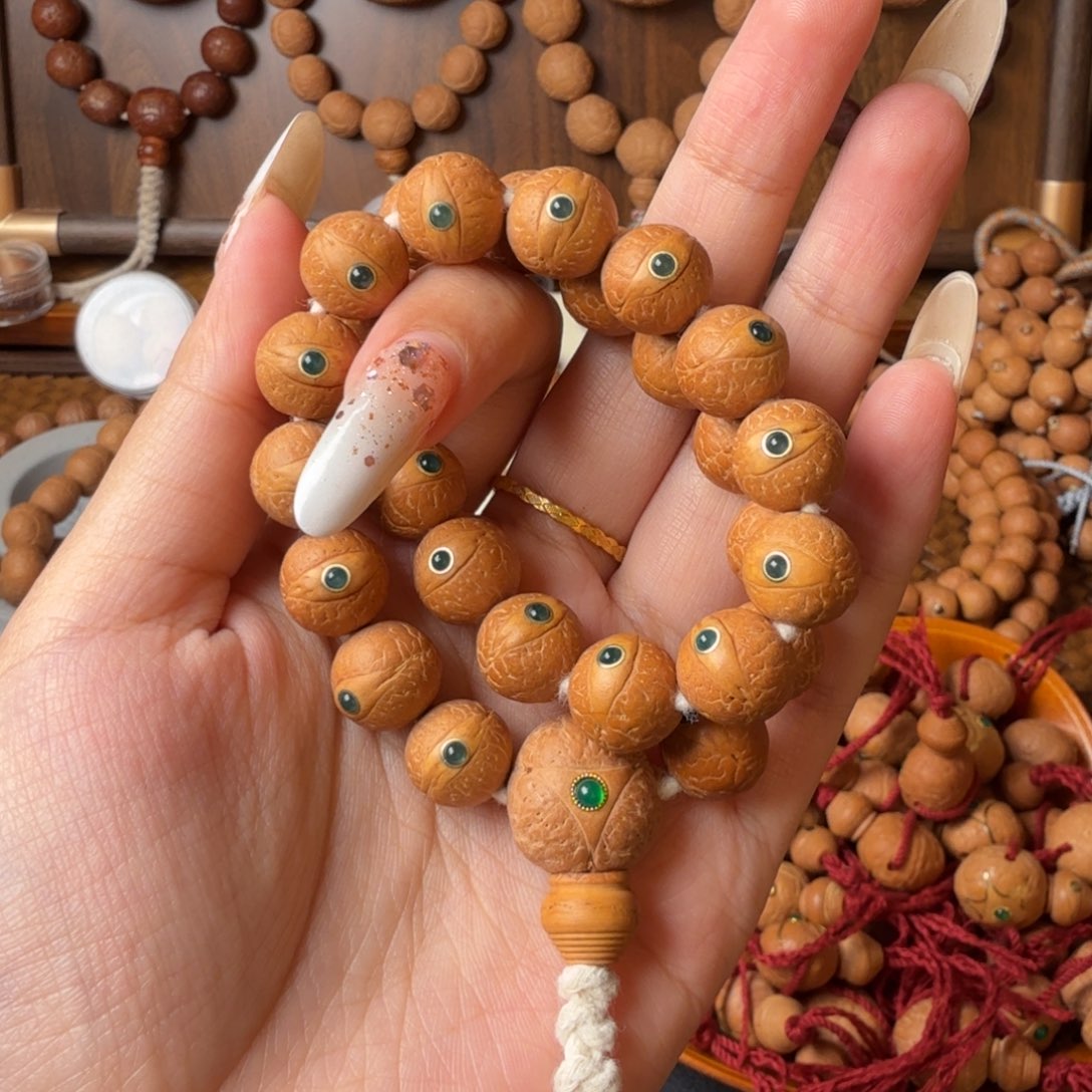 凤眼菩提把件12mm/27颗手持/镶嵌绿玛