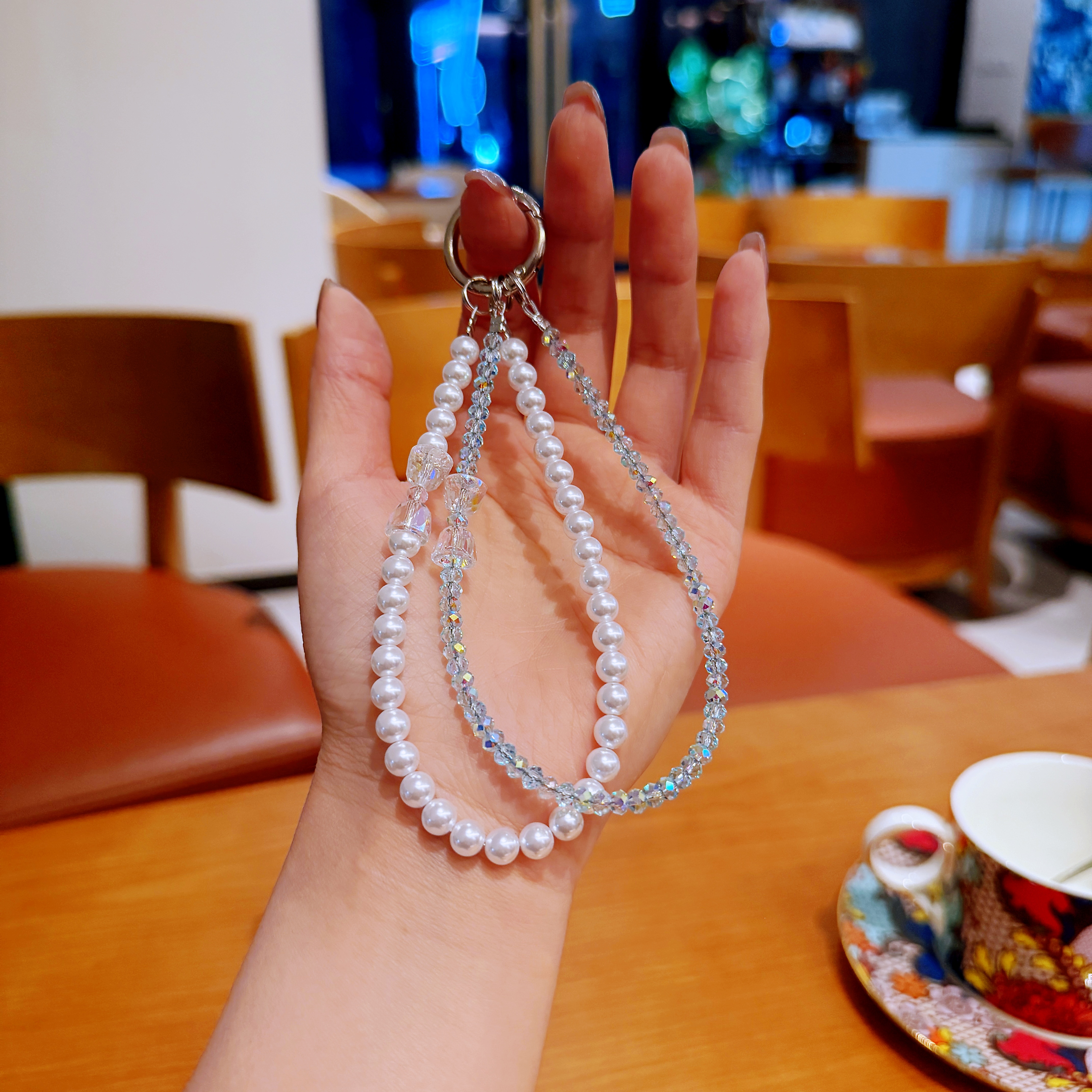 282浅浅蓝冰透简约水晶手机链国华珍珠铃铛手机链女款创意防丢