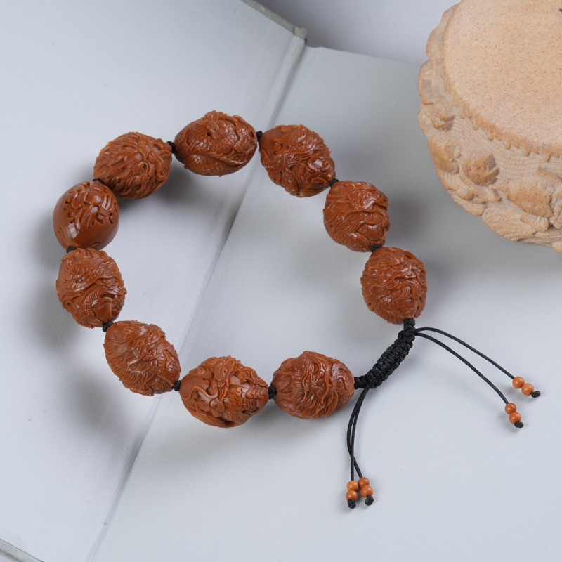 九龙献瑞橄榄核手串-梅林铁核雕刻