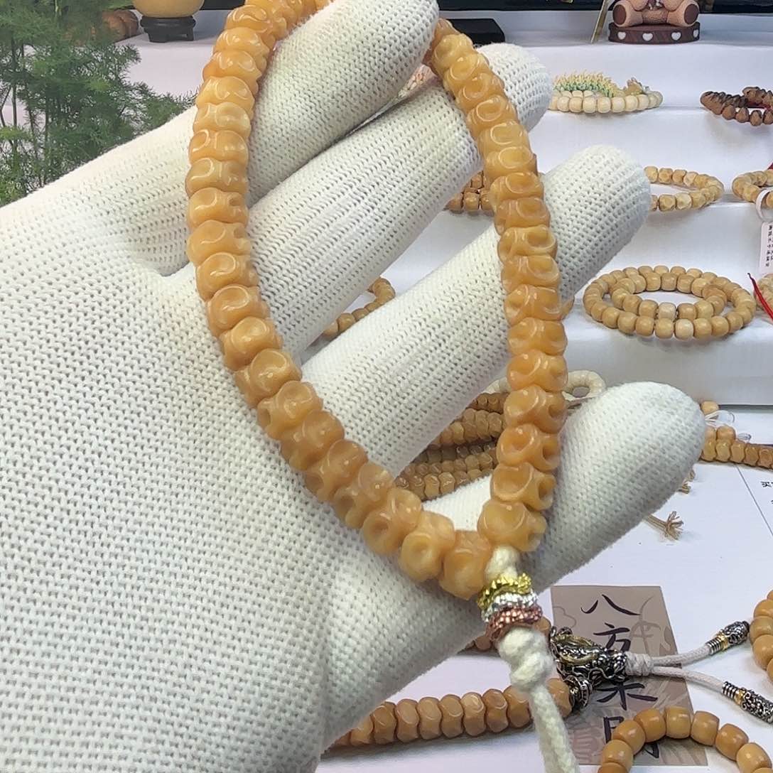 菩提根/象牙果把件赵****?龙脊菩提雕刻紧箍咒玉化