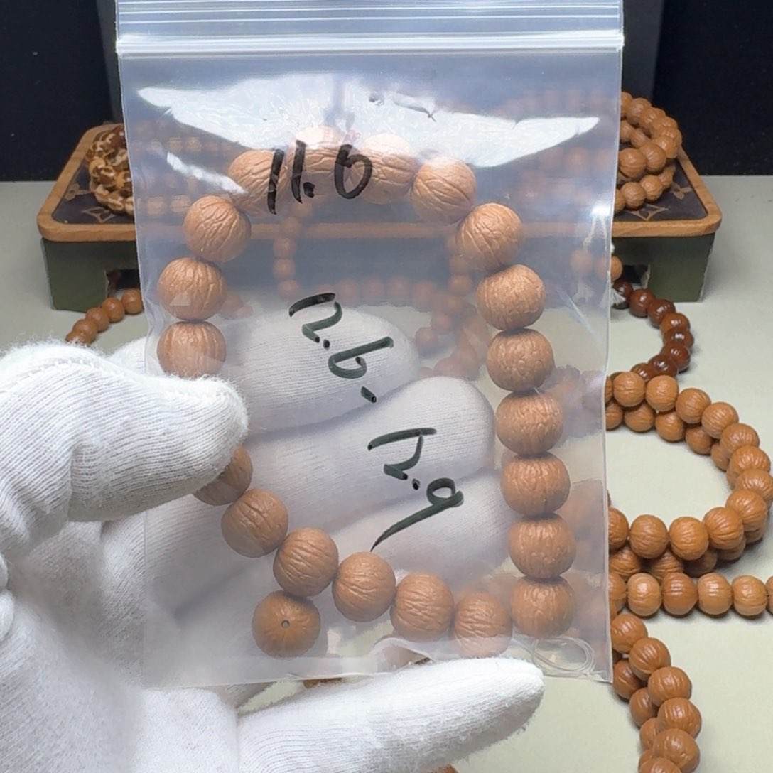 猴头核桃手串?磨盘凤羽