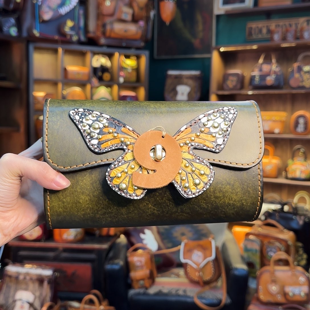 乔***_牦牛剖层皮革蓝莓单肩橄榄绿