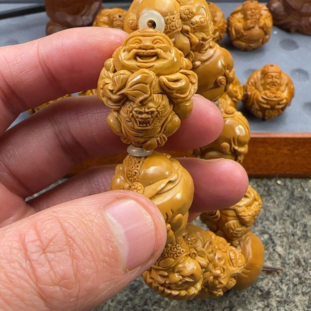 橄榄核吊坠笑**鸿………………