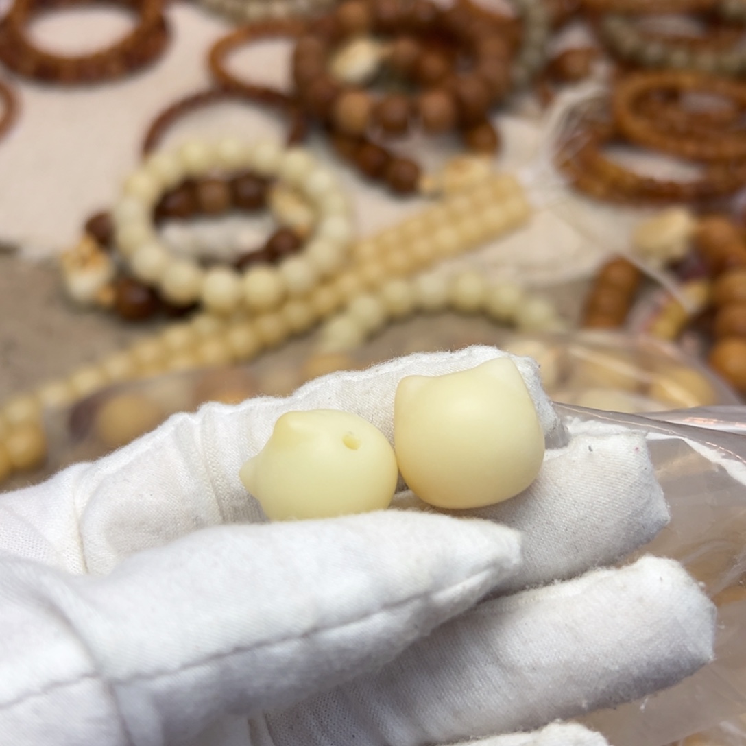 小***-吊坠菩提根/象牙果猫头三通两h909