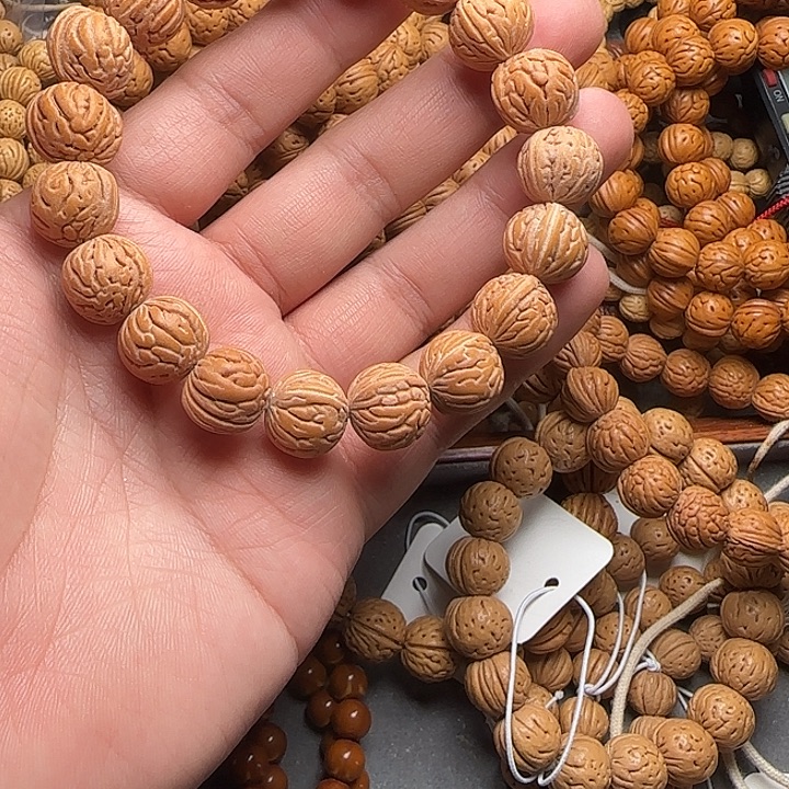 星***晨野生桃核大肠纹手串