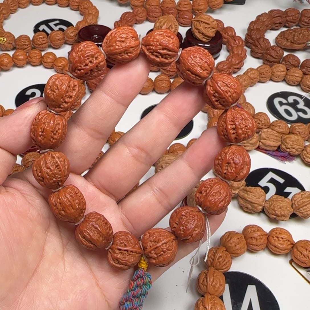 文玩核桃吊坠子弹头元宝