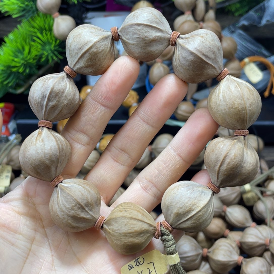 哼***哈吊坠橄榄核2527四花铁核