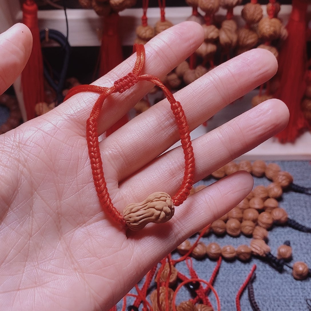 杰***植吊坠桃核桃枭手串