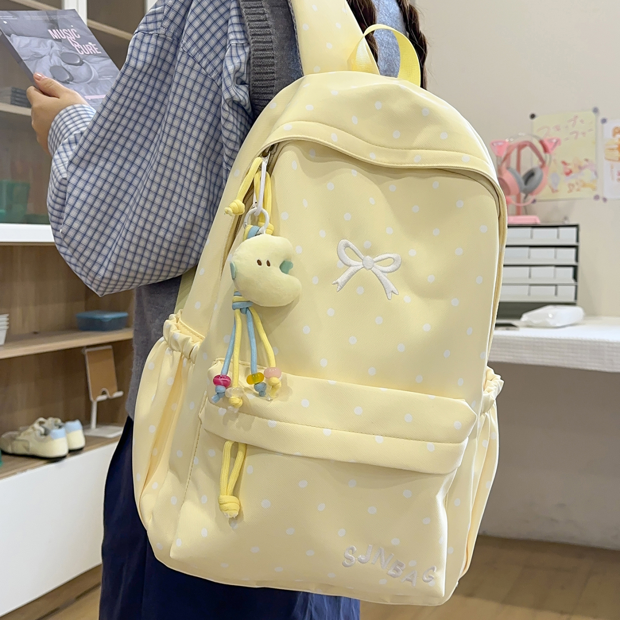 波点减负初中生书包大容量通勤包韩版女双肩包透气女生小学生新款