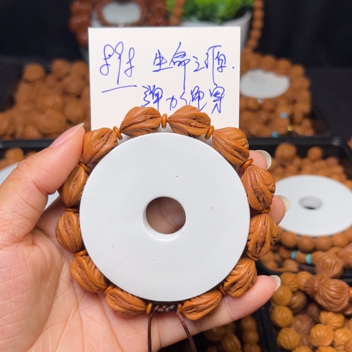 桃核把件勇**步生命之源精品