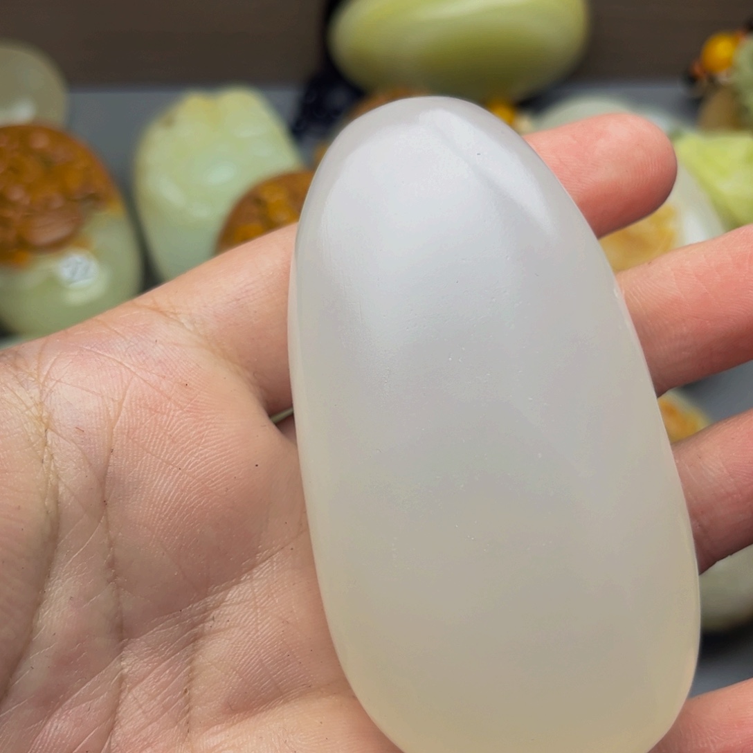 似***兰石材方解石手把件