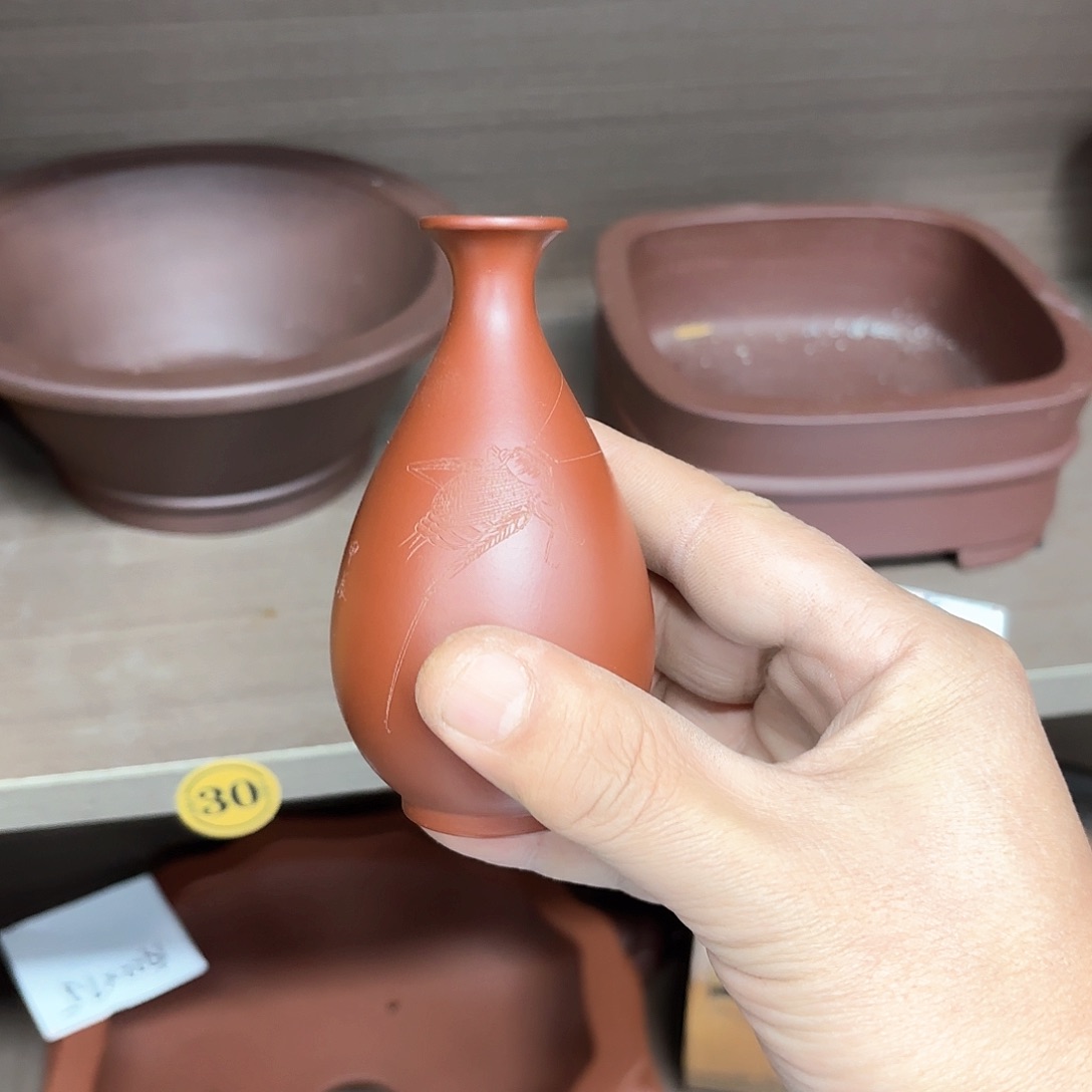 紫砂花盆I***吐紫砂的味道真的是