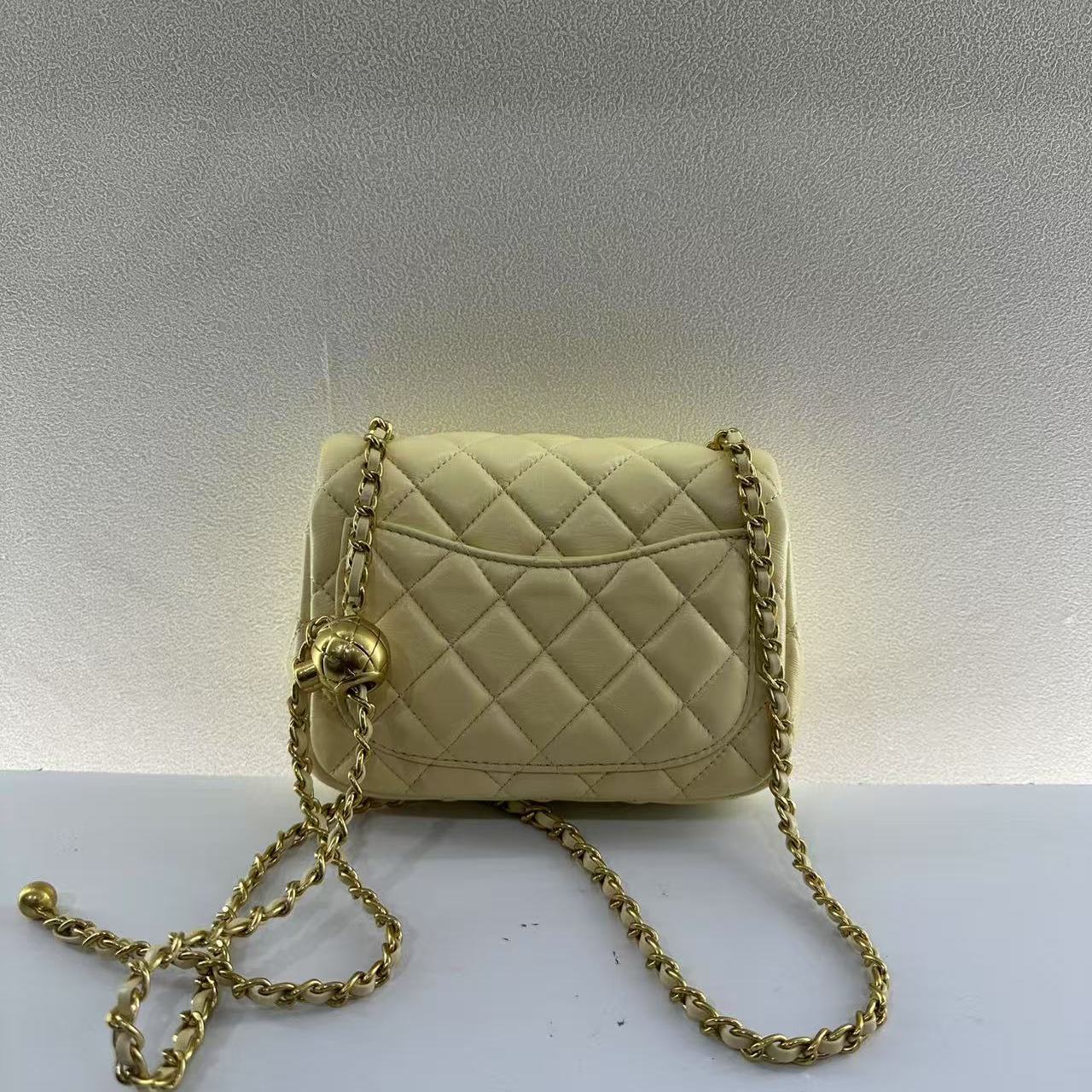 2025新款真皮女包小金球黄色