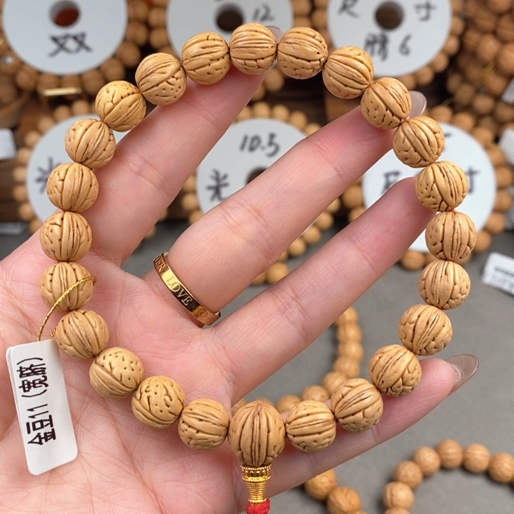 桃核手串金豆11宽……