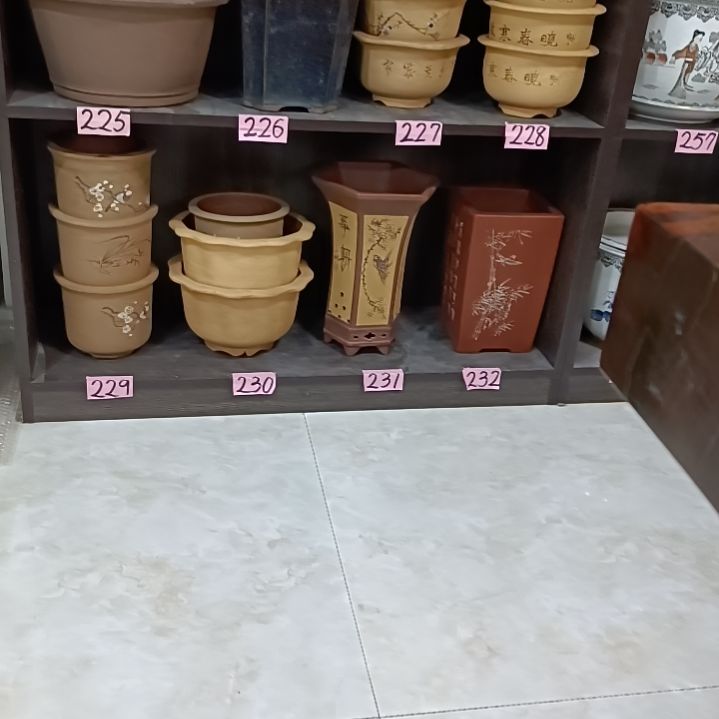 红陶前**量圆形瓷盆