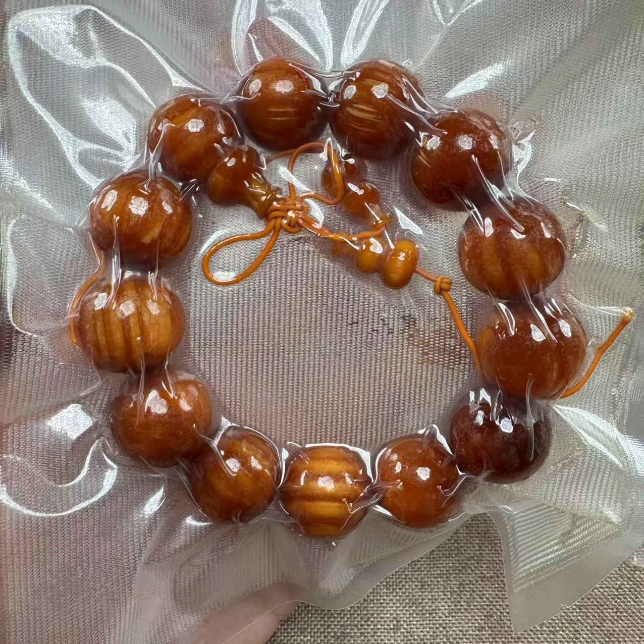 【芸奇】琥珀木松明子1.8单圈文玩手串随机发