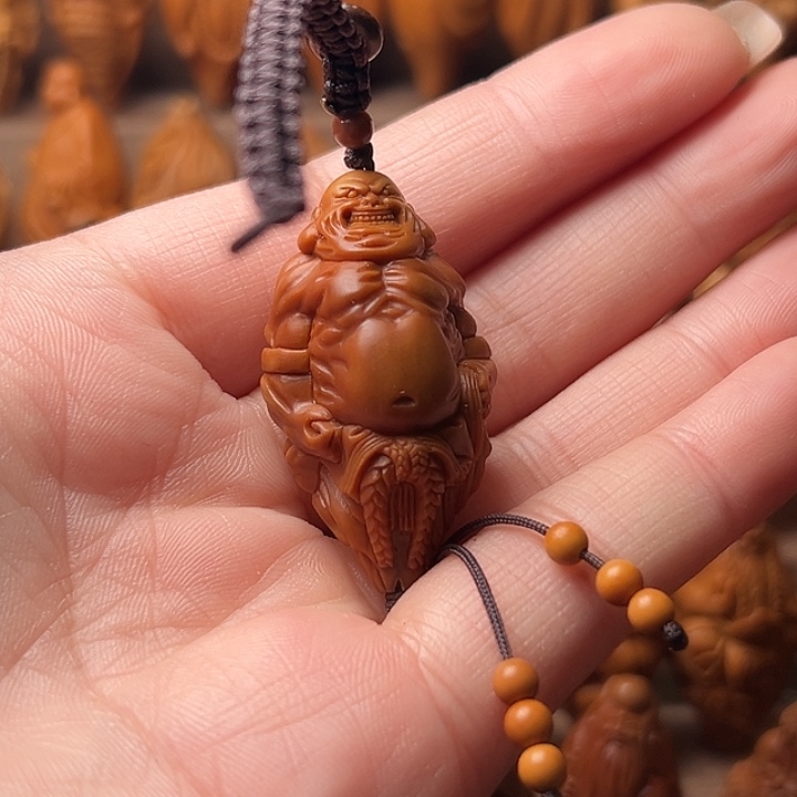 橄榄核吊坠还**透橄榄核