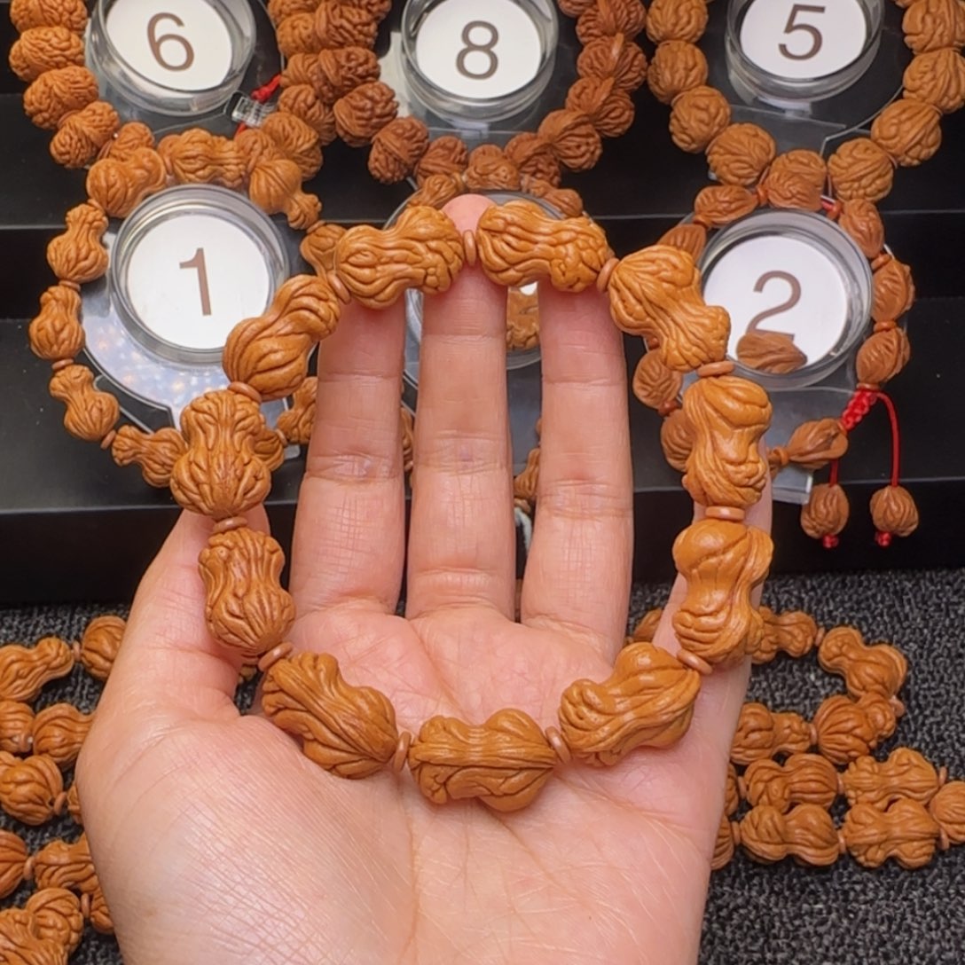 华***董吊坠桃核花生手串