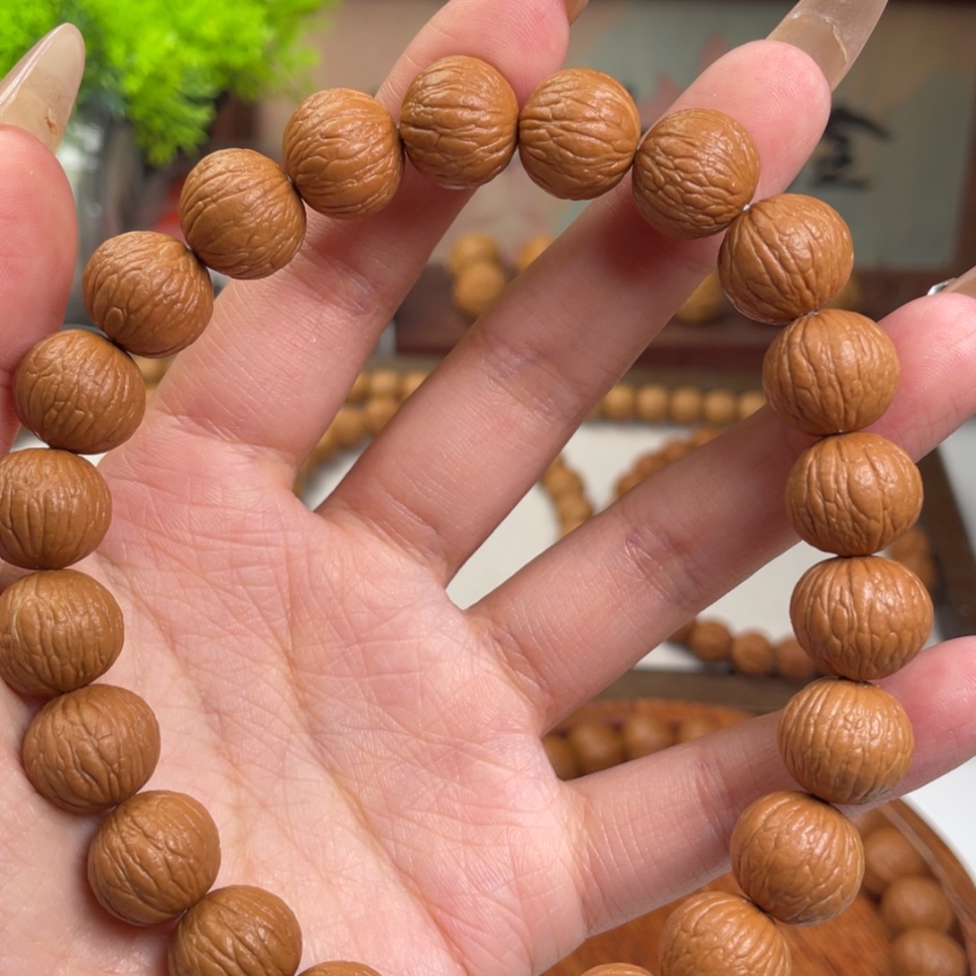 黑***子猴头核桃手串凤羽