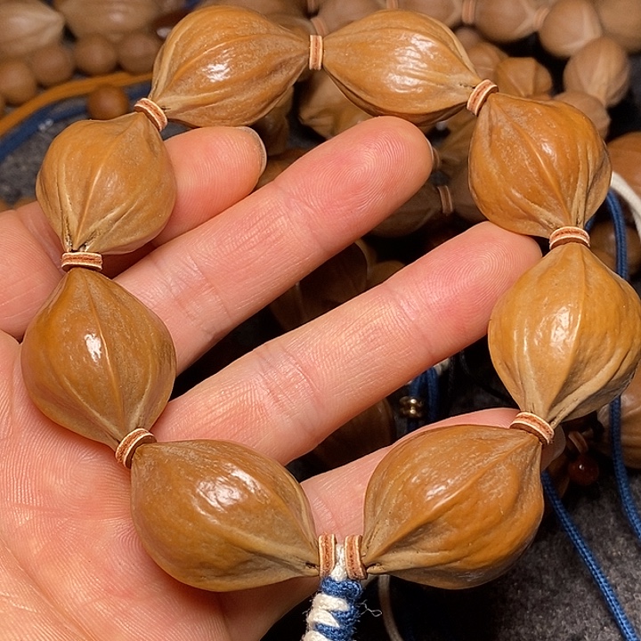 橄榄核手串2.3四花手持26号