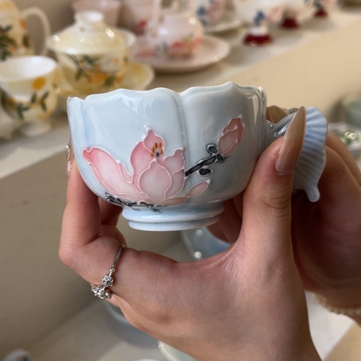 手把杯。              