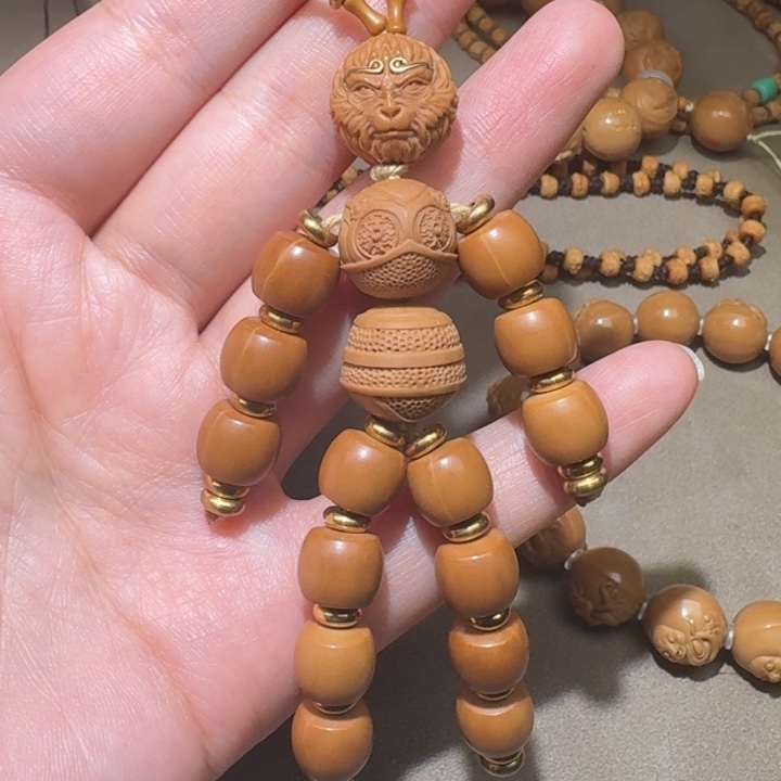 橄榄核把件大圣手捻