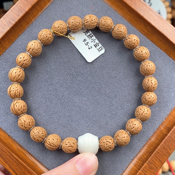 桃核手串宽脐小金豆9.5-2 抛光尺寸误差0.5之间