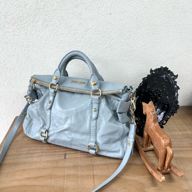 95新 MIU MIU/缪缪 天蓝色蝴蝶结油腊皮机车单肩斜挎包 063276
