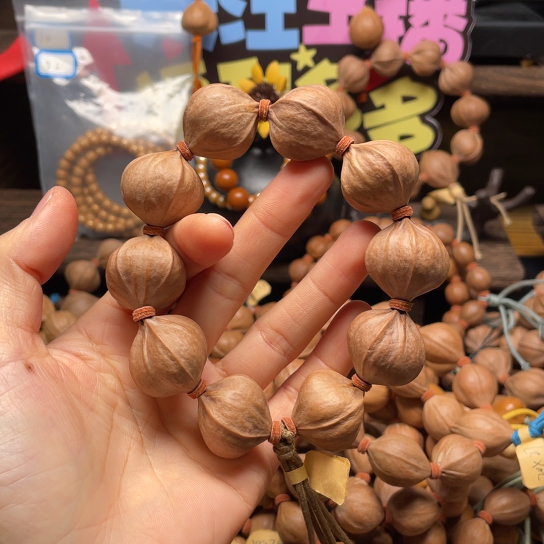 奥***卡橄榄核吊坠四花铁核