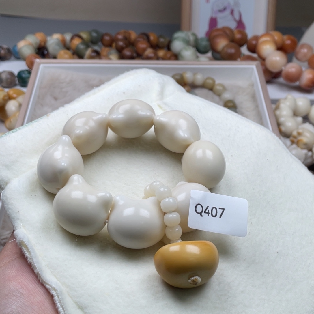 小***儿吊坠菩提根/象牙果Q407猫头手持28mm一串通货