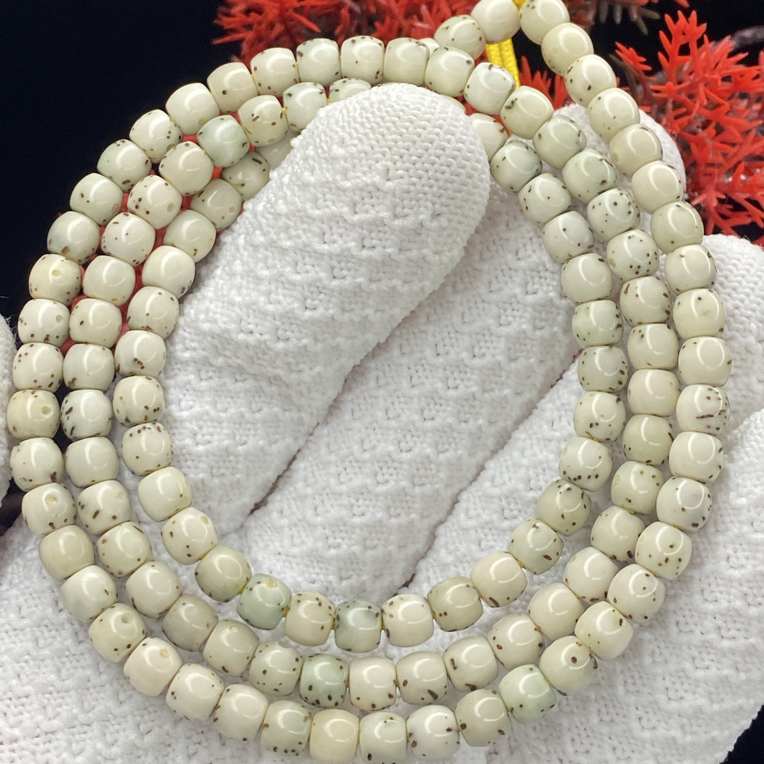 星月菩提海南原生态石玉料鼓珠大留白6*5长串