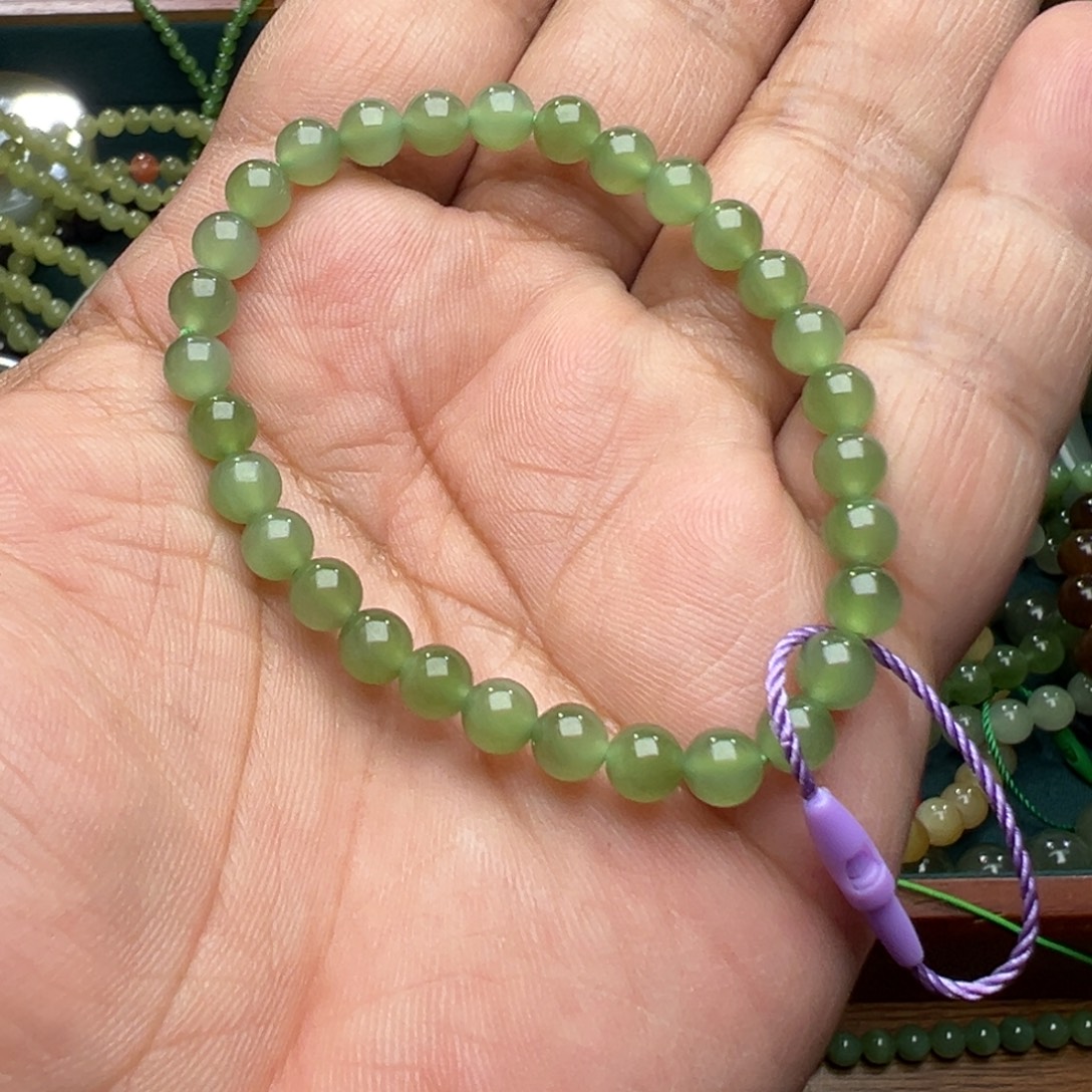 我***鱼和田玉未镶嵌手串