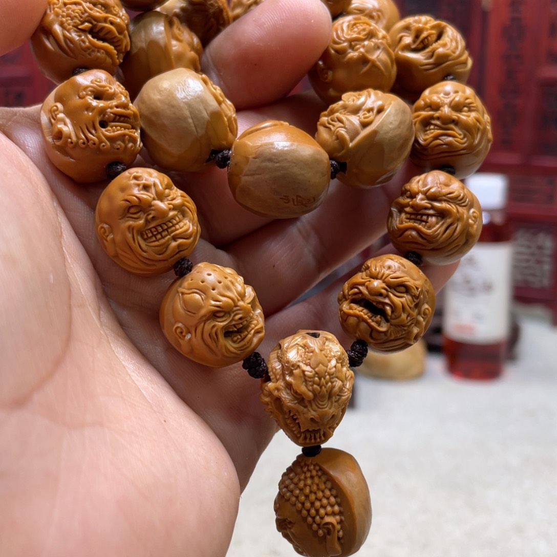 橄榄核吊坠鸠**閪橄榄核雕