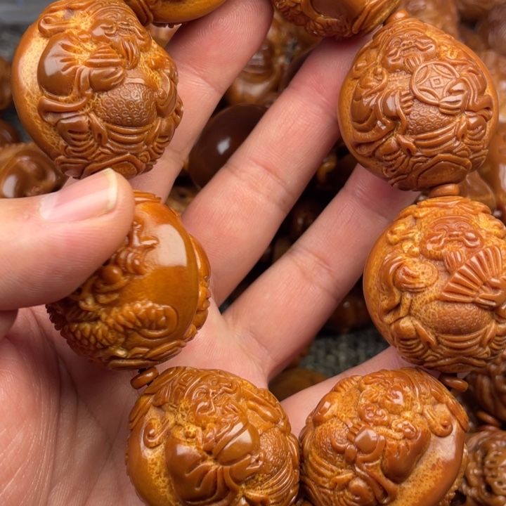 橄榄核吊坠明**板橄榄核手持