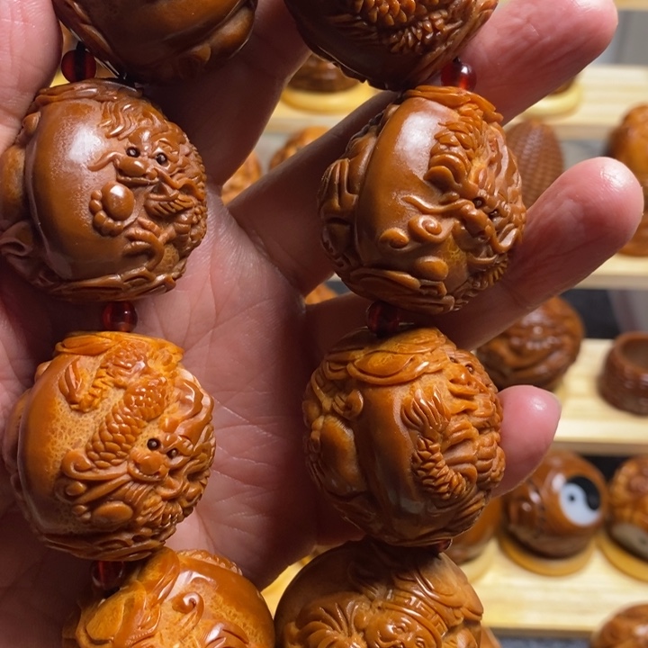 河***易橄榄核把件巴西进口大橄榄哥龙财手持一条