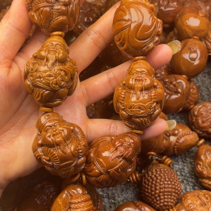 橄榄核吊坠向*葵橄榄核