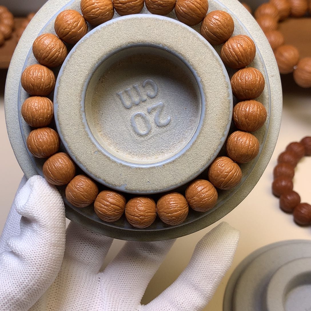 “***”吊坠猴头核桃12凤羽全品手串