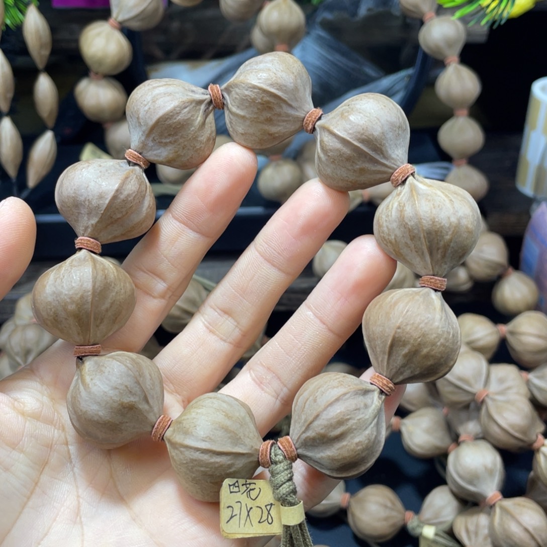 按***难橄榄核吊坠2728铁核四花