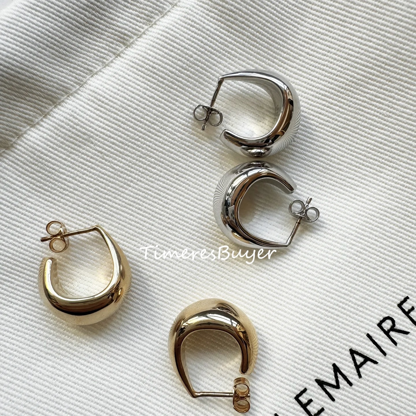 烙哥MEEGHERBE·新款老妹银色弧形水滴耳H