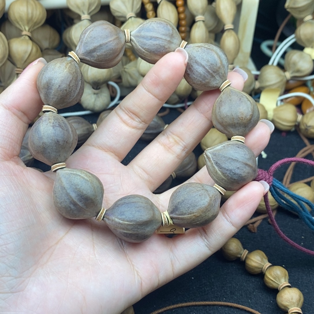 吴***虑橄榄核手串/手链2226三花紫皮10颗
